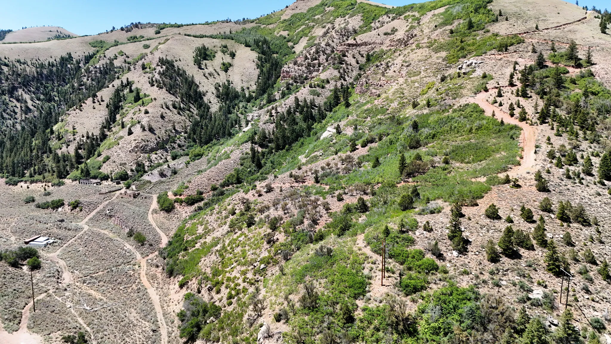 View of mountain backdrop featuring rural landscape