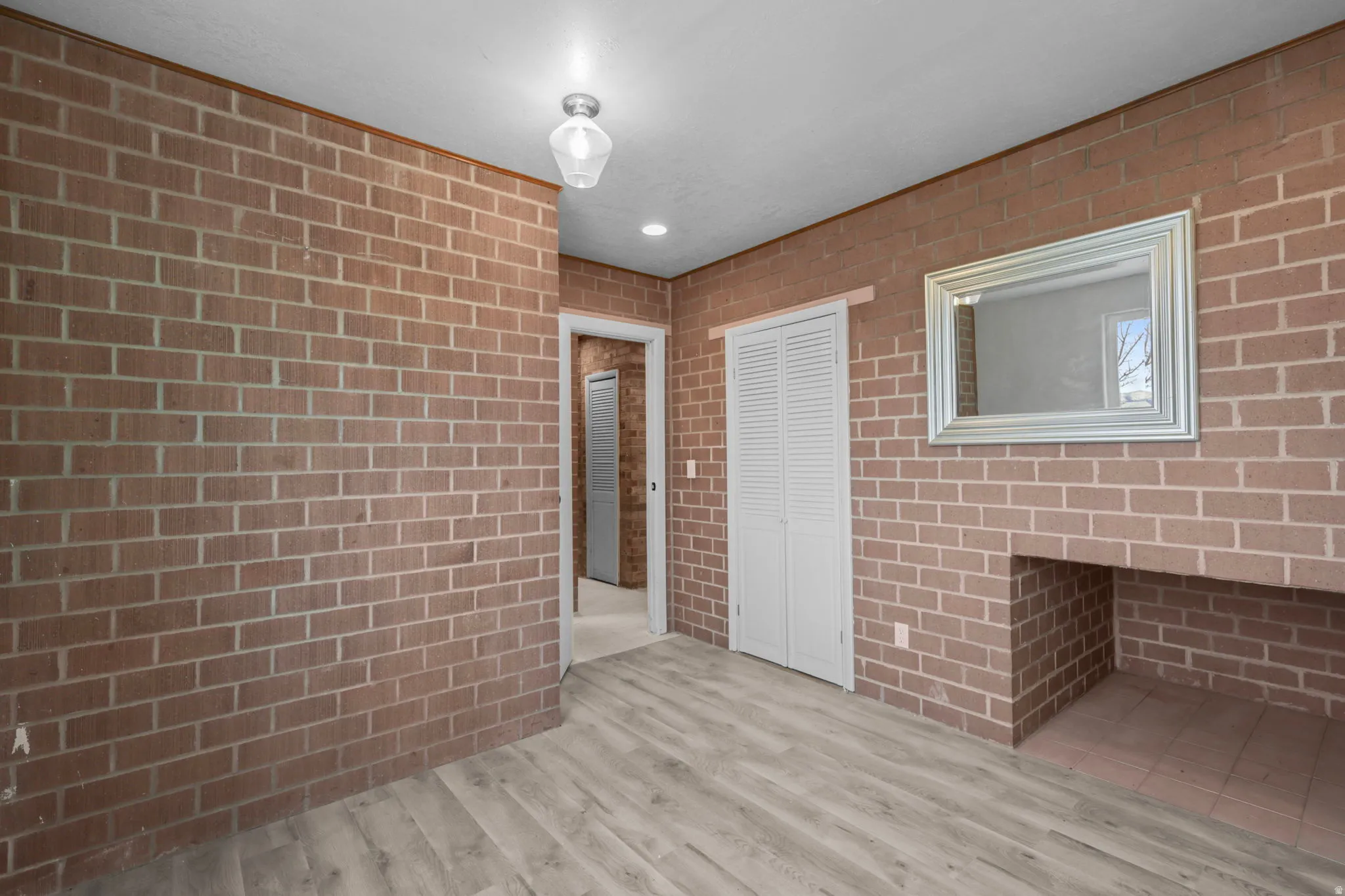 Interior space with light wood-style floors and recessed lighting