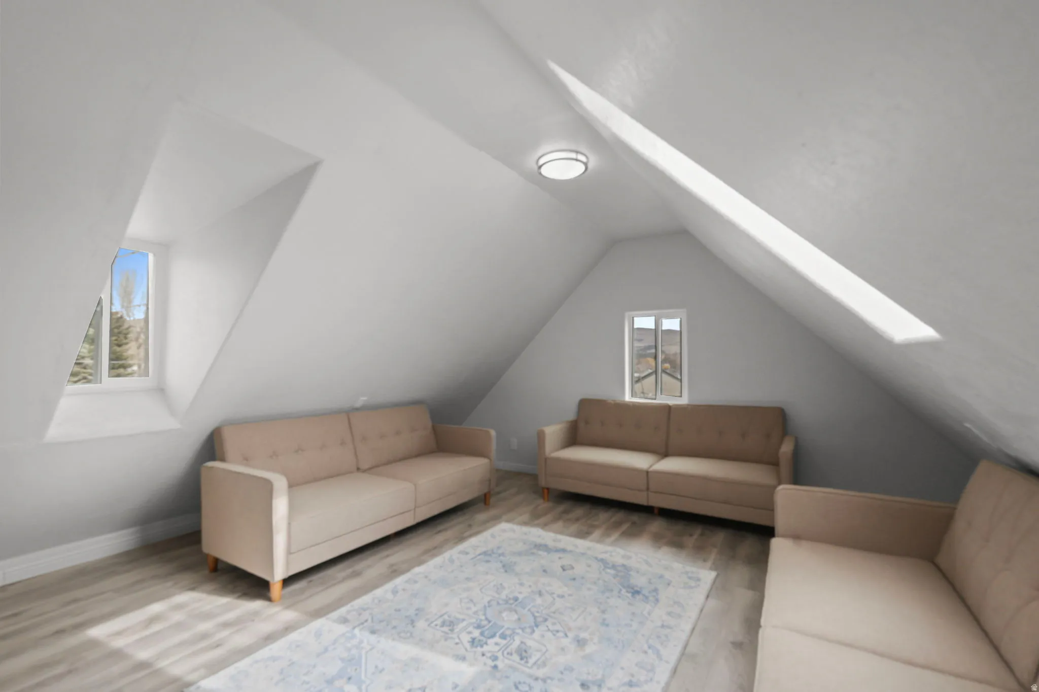 Living room with wood finished floors and baseboards