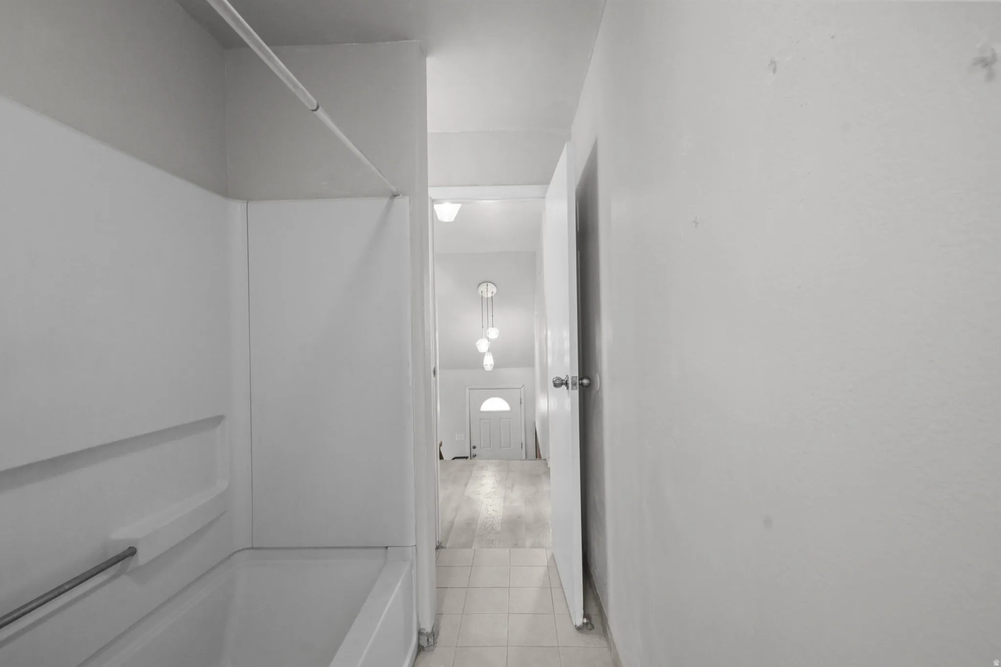 Bathroom featuring shower / washtub combination and light tile patterned floors