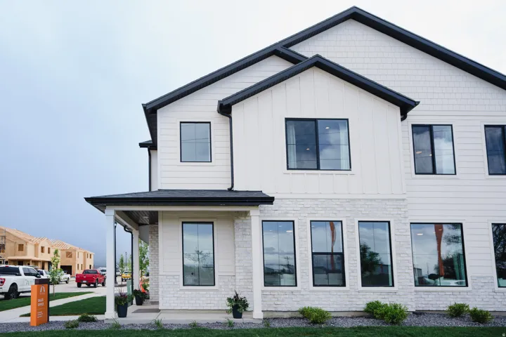 View of front of property with a porch and board and batten siding