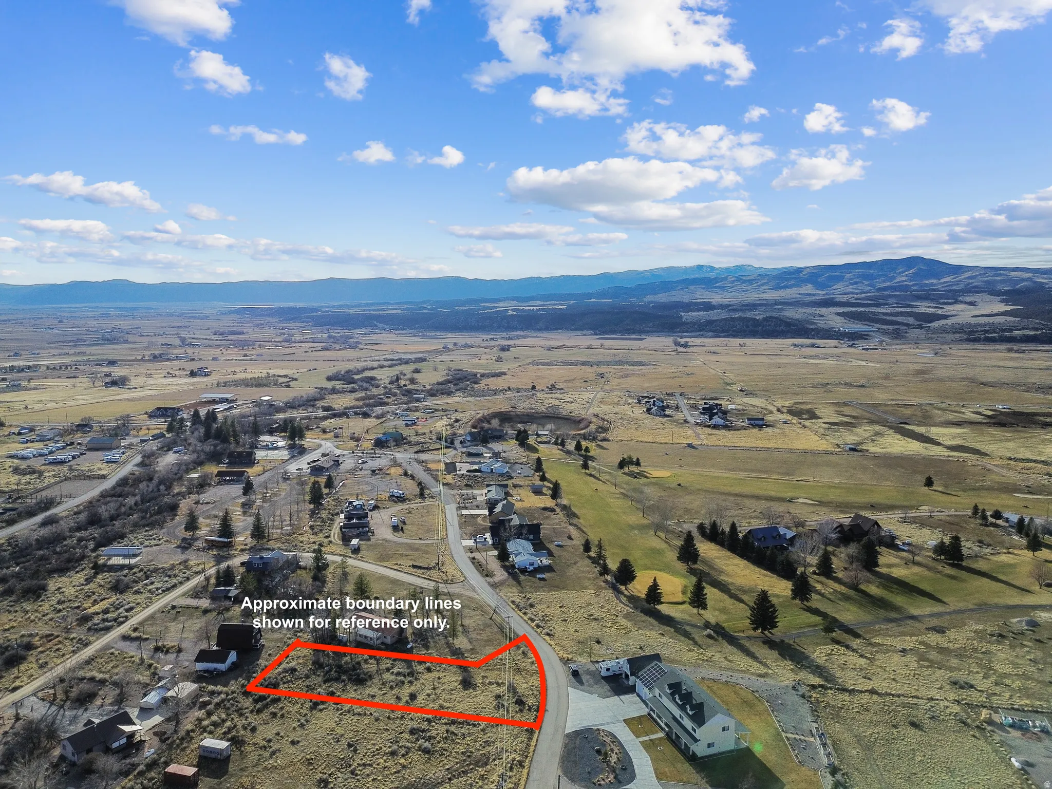 View of rural area featuring a mountain backdrop and property boundaries highlighted