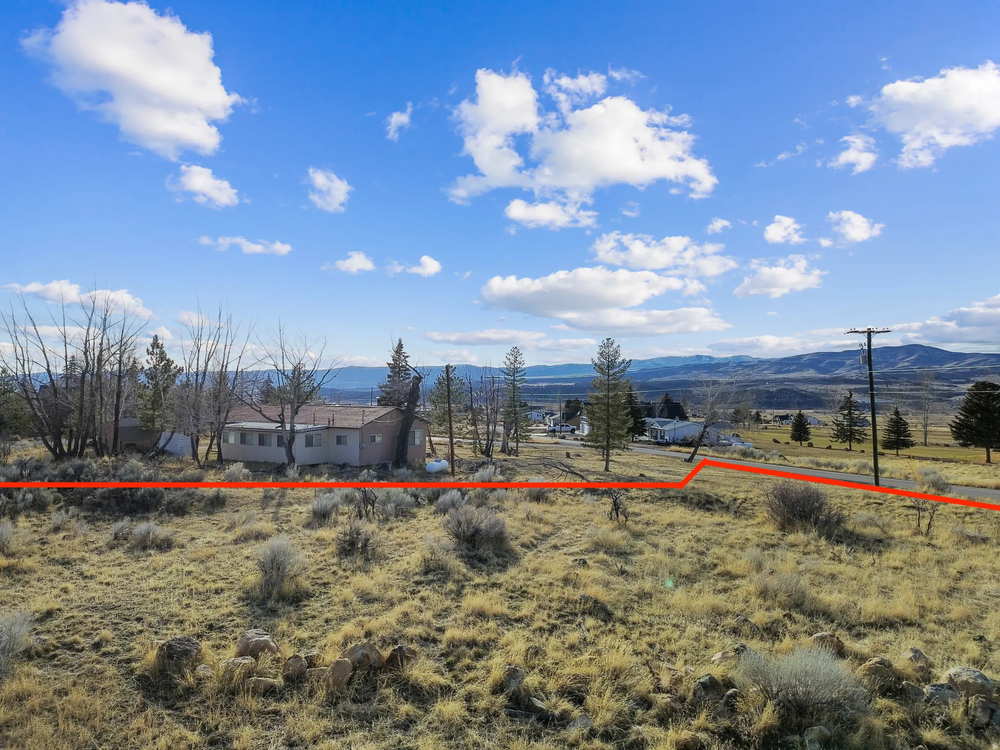 View of yard featuring a mountain view and a view of rural / pastoral area