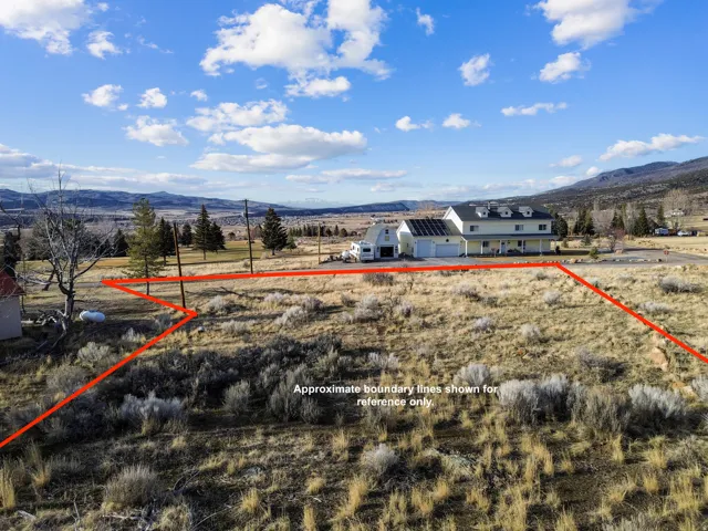 View of rural area with a mountain backdrop and property boundaries highlighted