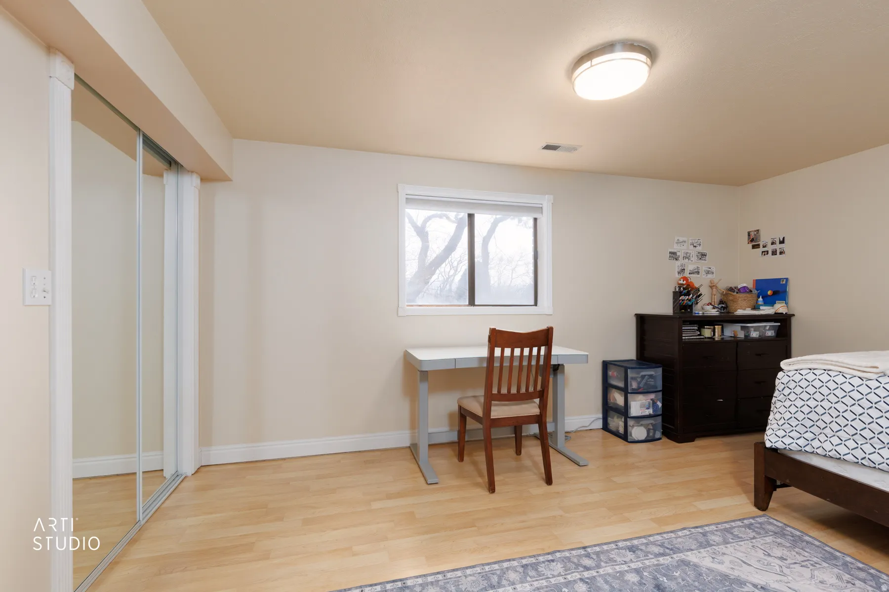Bedroom featuring light wood-type flooring and baseboards