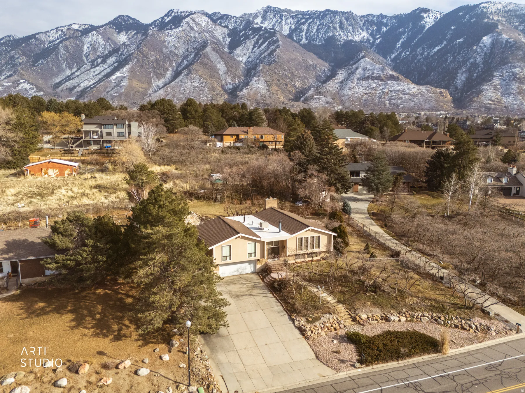 Aerial view of residential area featuring mountains