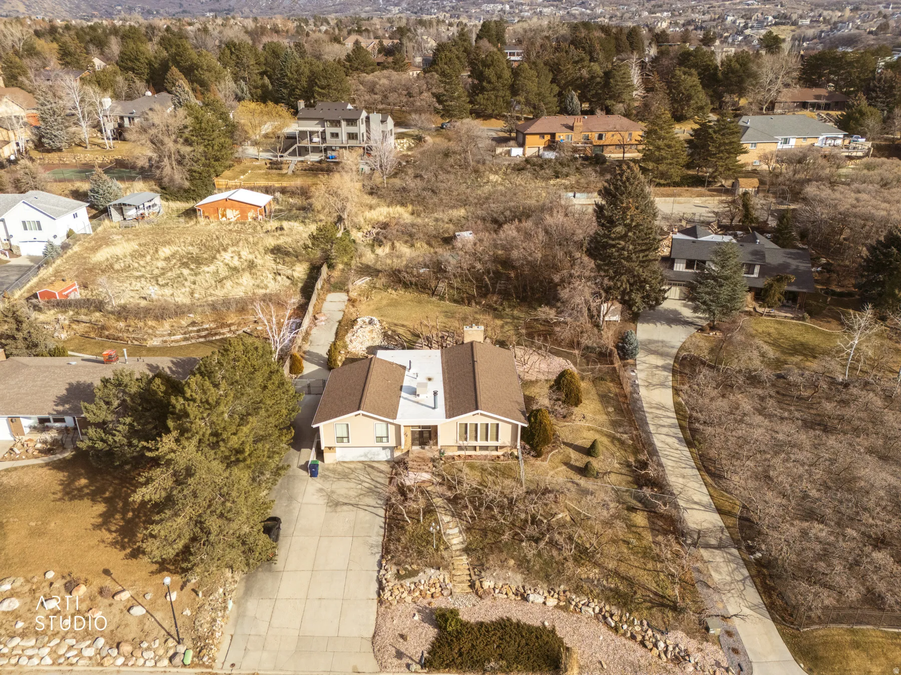 Aerial view of property's location featuring nearby suburban area