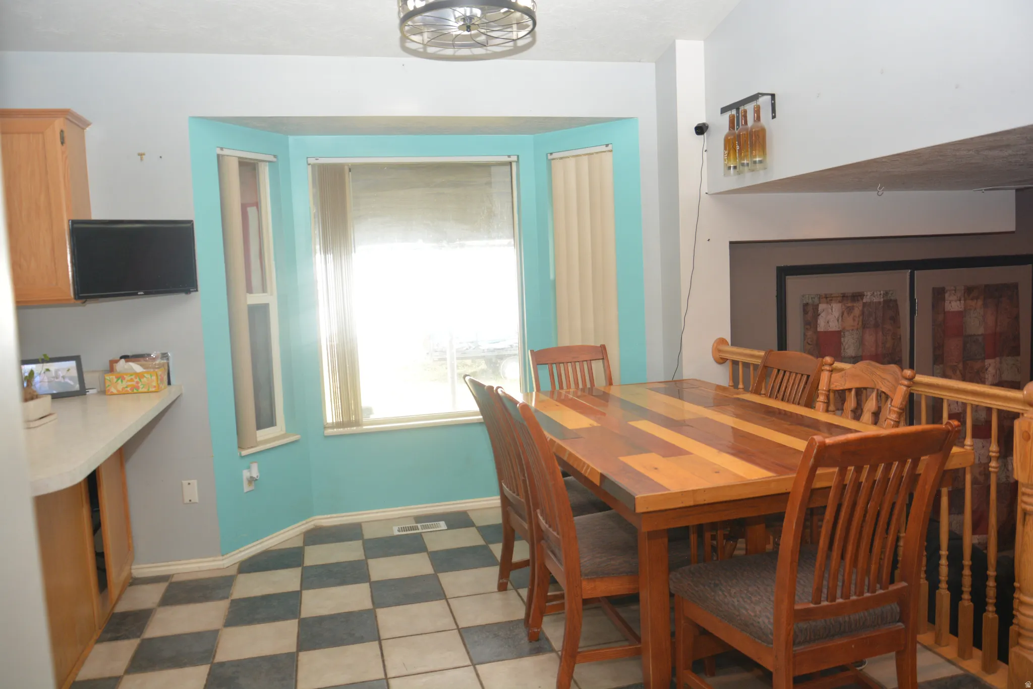 Dining space with light floors and baseboards