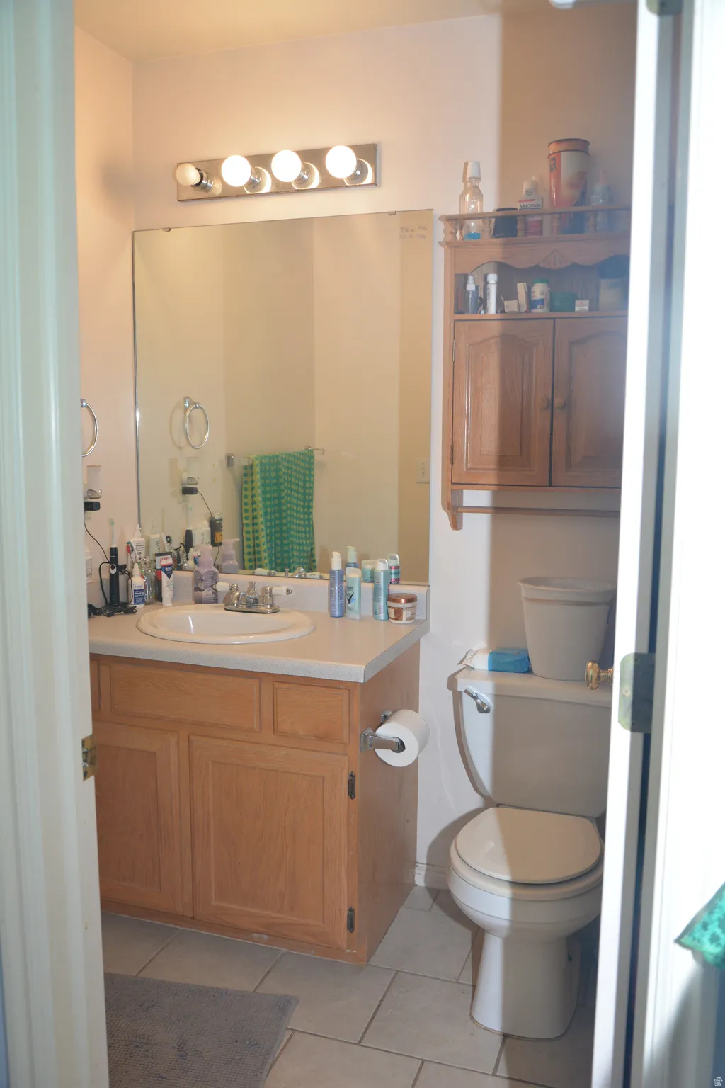 Bathroom with vanity and light tile patterned floors