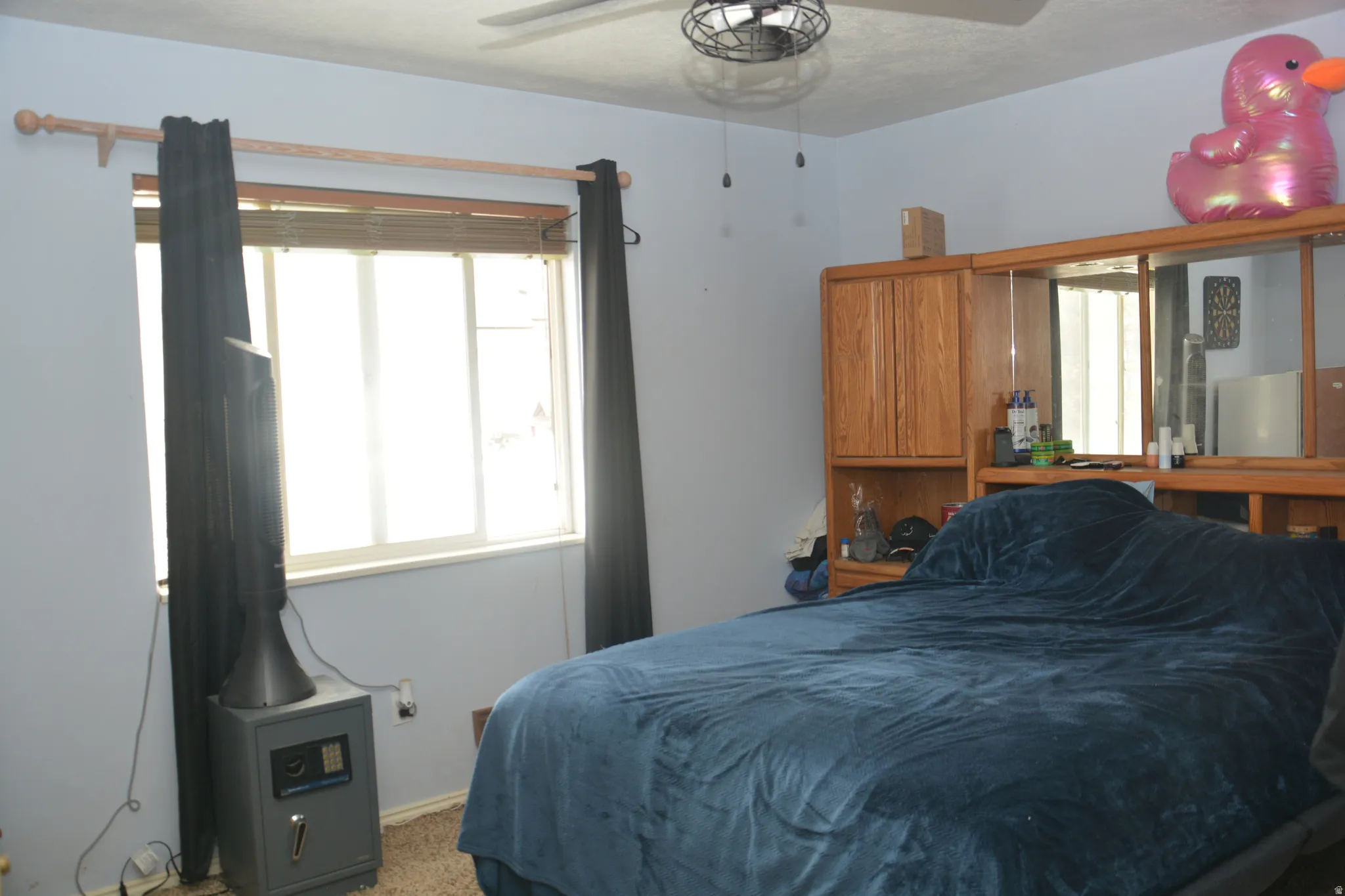 Bedroom with carpet and a ceiling fan