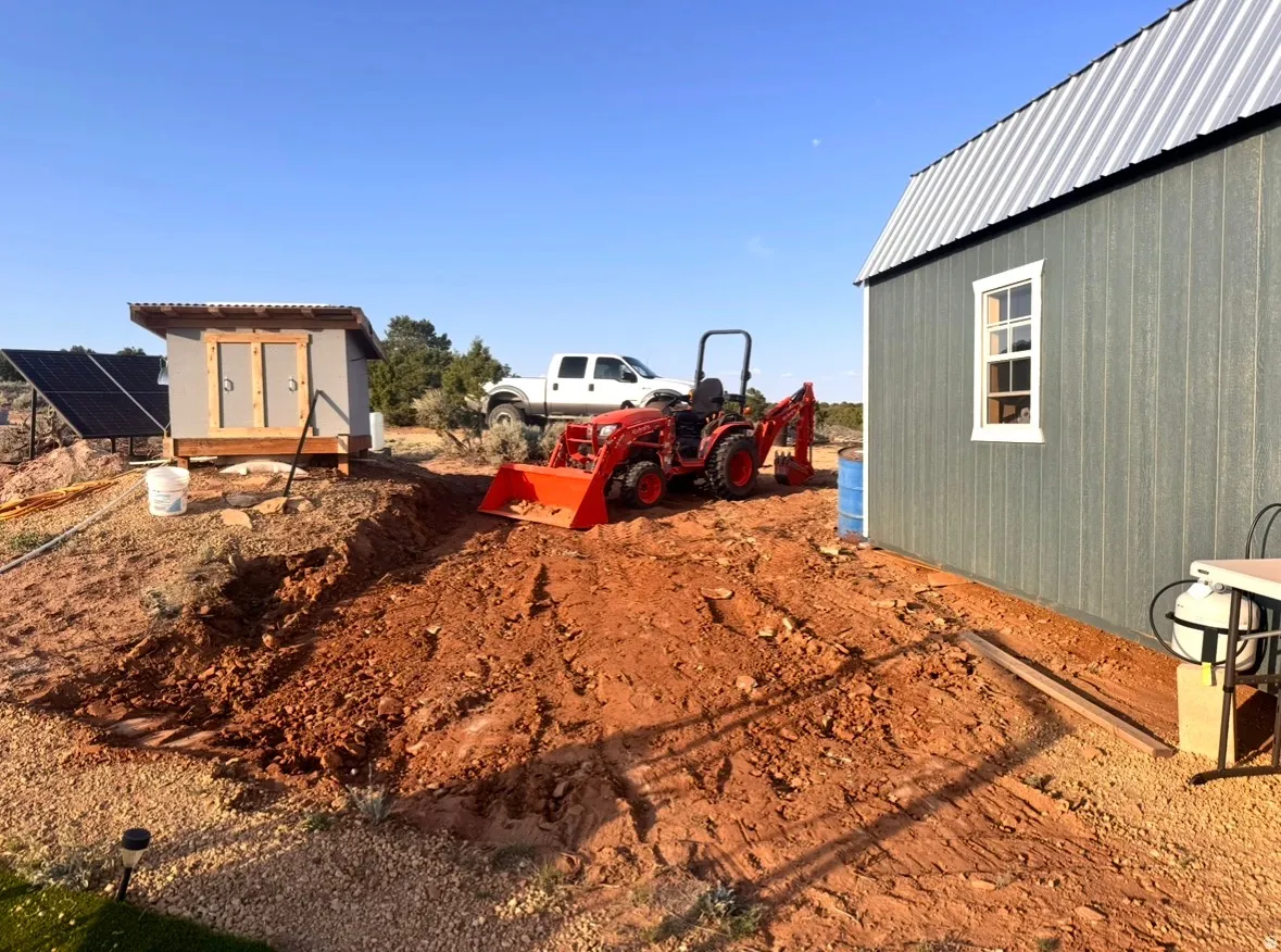 Bunkhouse, cistern/pump house. Clearing spot for an addition to bunkhouse