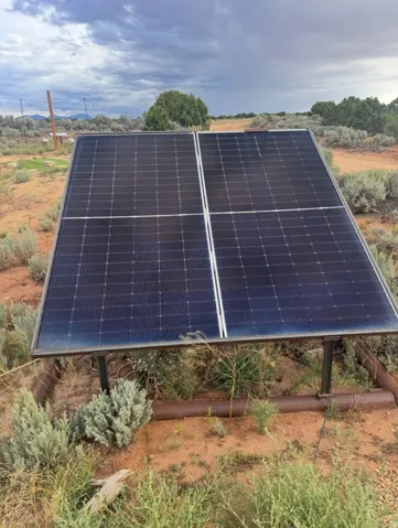 Ground-mounted solar panels for well pump