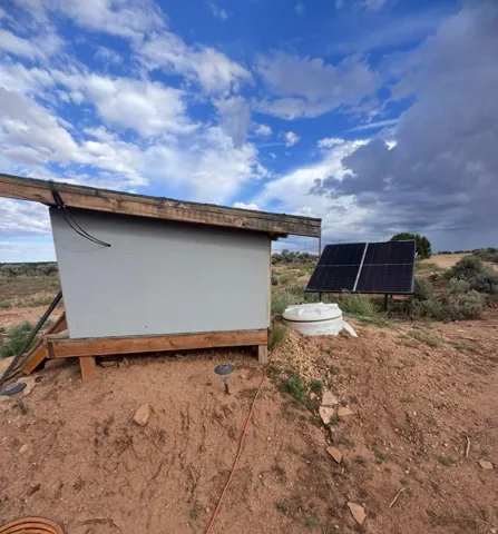 pumphouse, cistern tank, solar panel for well pump