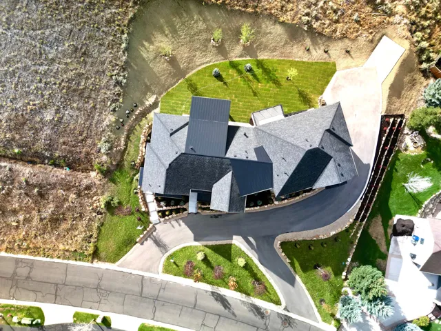 Asphalt shingle roofing with metal accents