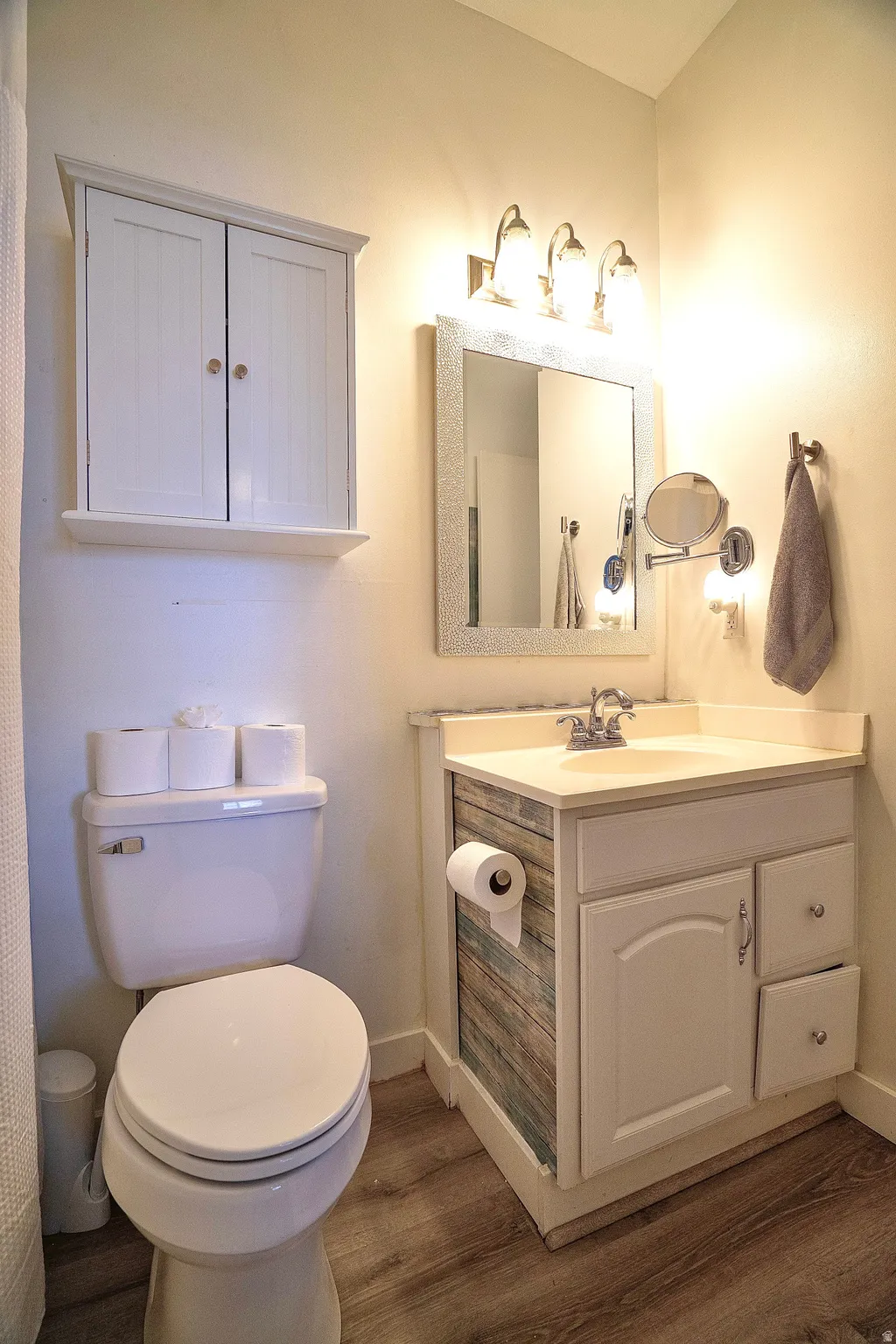 Bathroom featuring vanity and dark wood finished floors