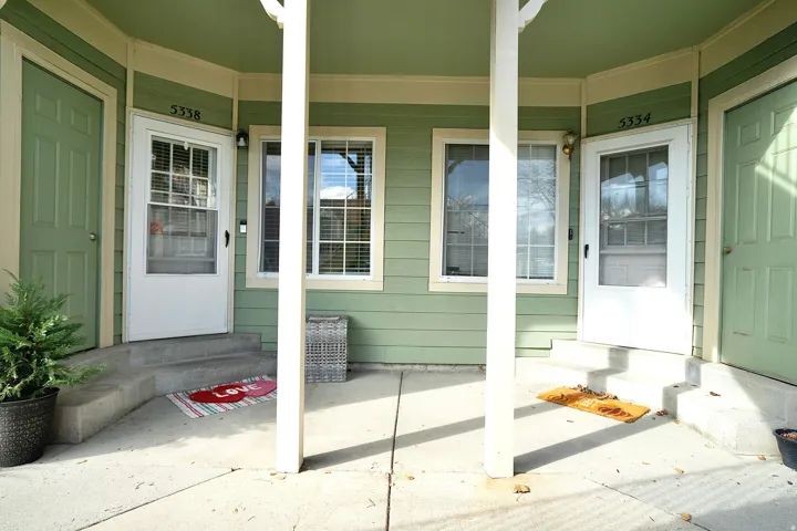 Doorway to property featuring a porch