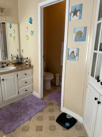 Bathroom with vanity and light tile patterned floors