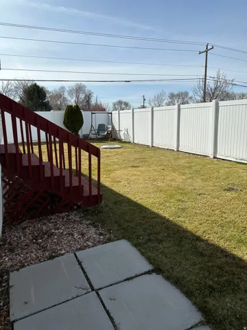 View of fenced backyard