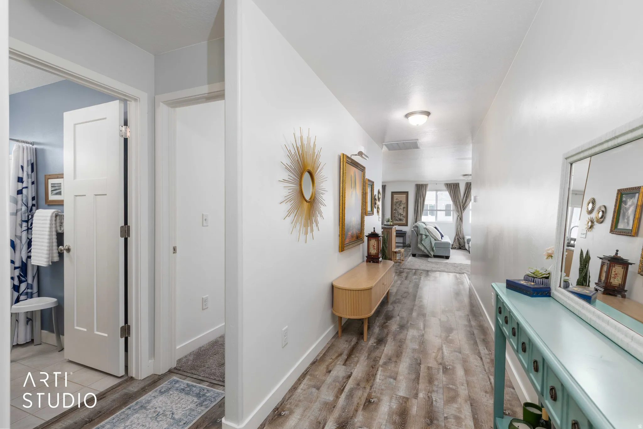 Hallway with light wood finished floors and baseboards