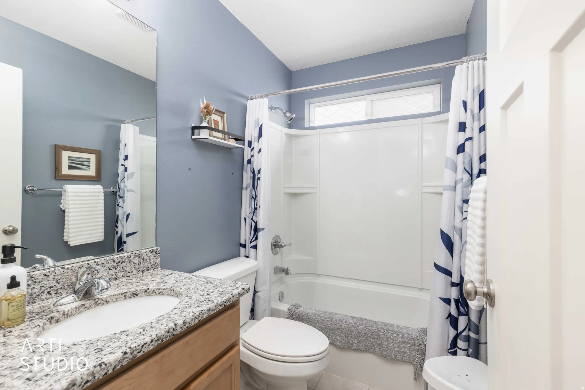 Full bathroom featuring vanity and shower / tub combo with curtain
