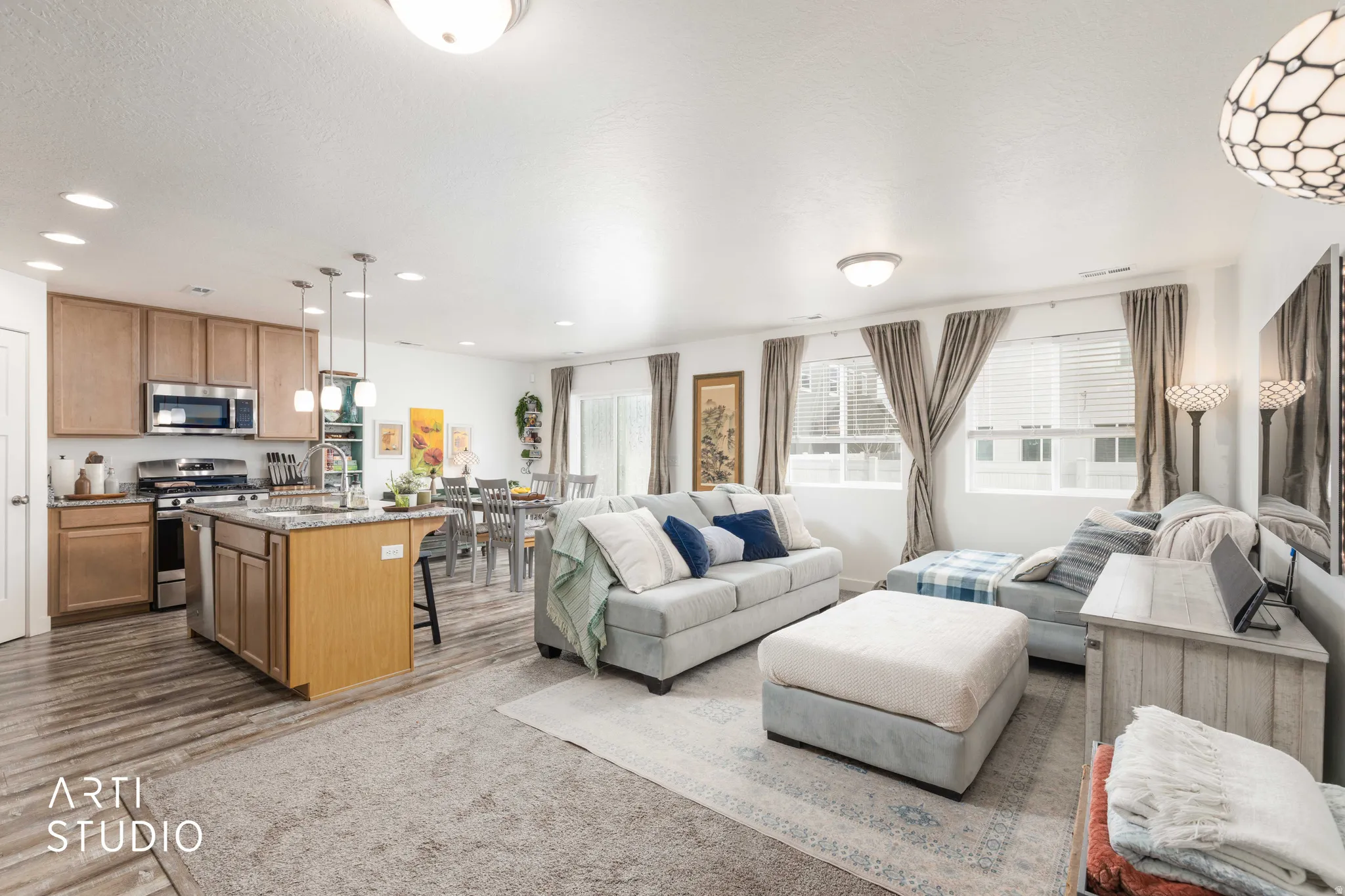 Living area with recessed lighting and dark wood finished floors
