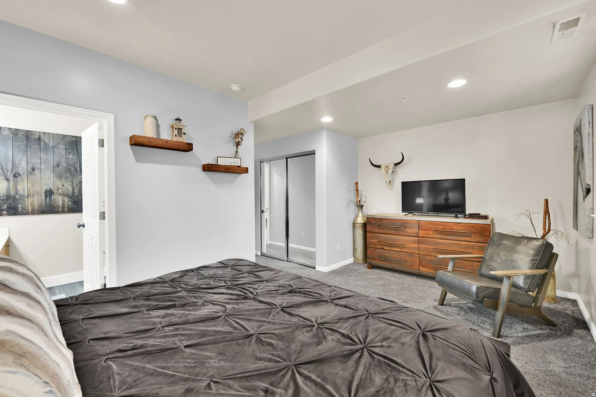 Bedroom with carpet flooring, recessed lighting, and a closet