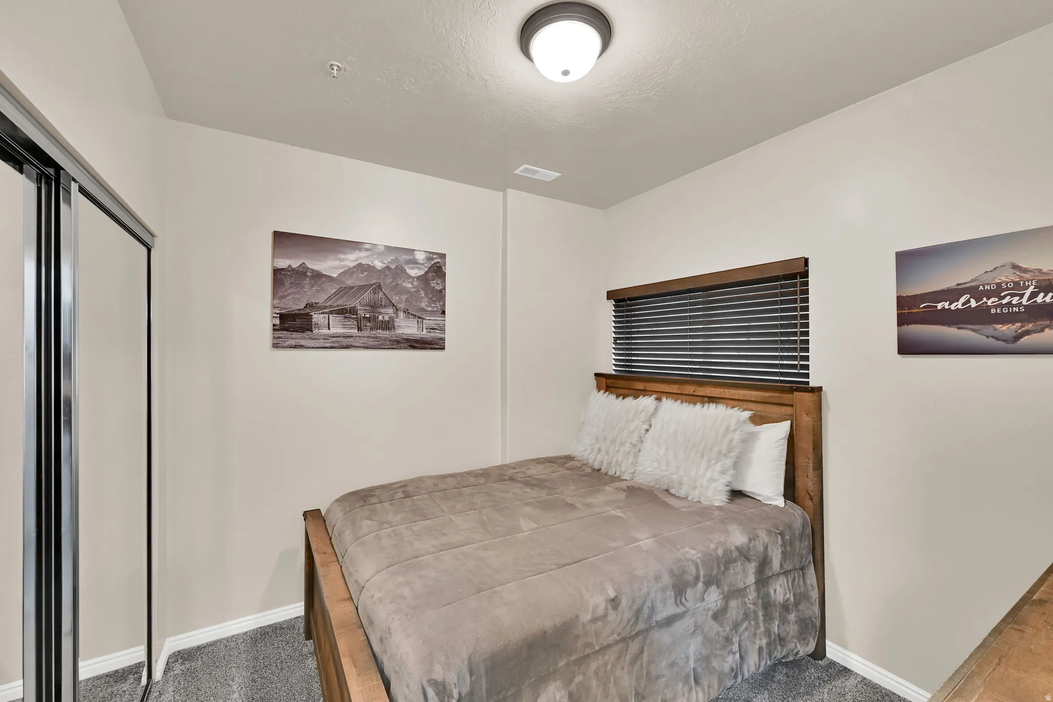 Bedroom with carpet floors and a closet