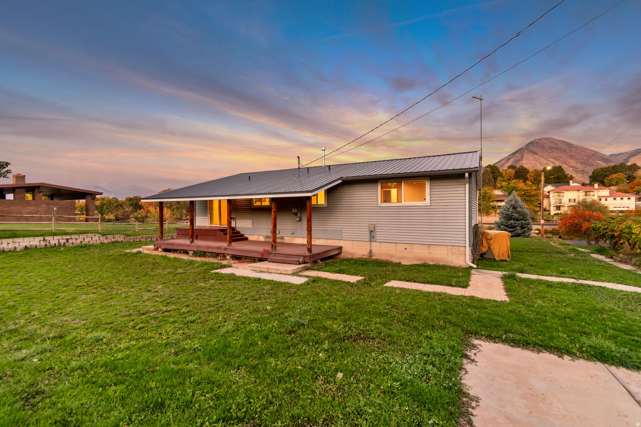View of front facade featuring a metal roof and a mountain view
