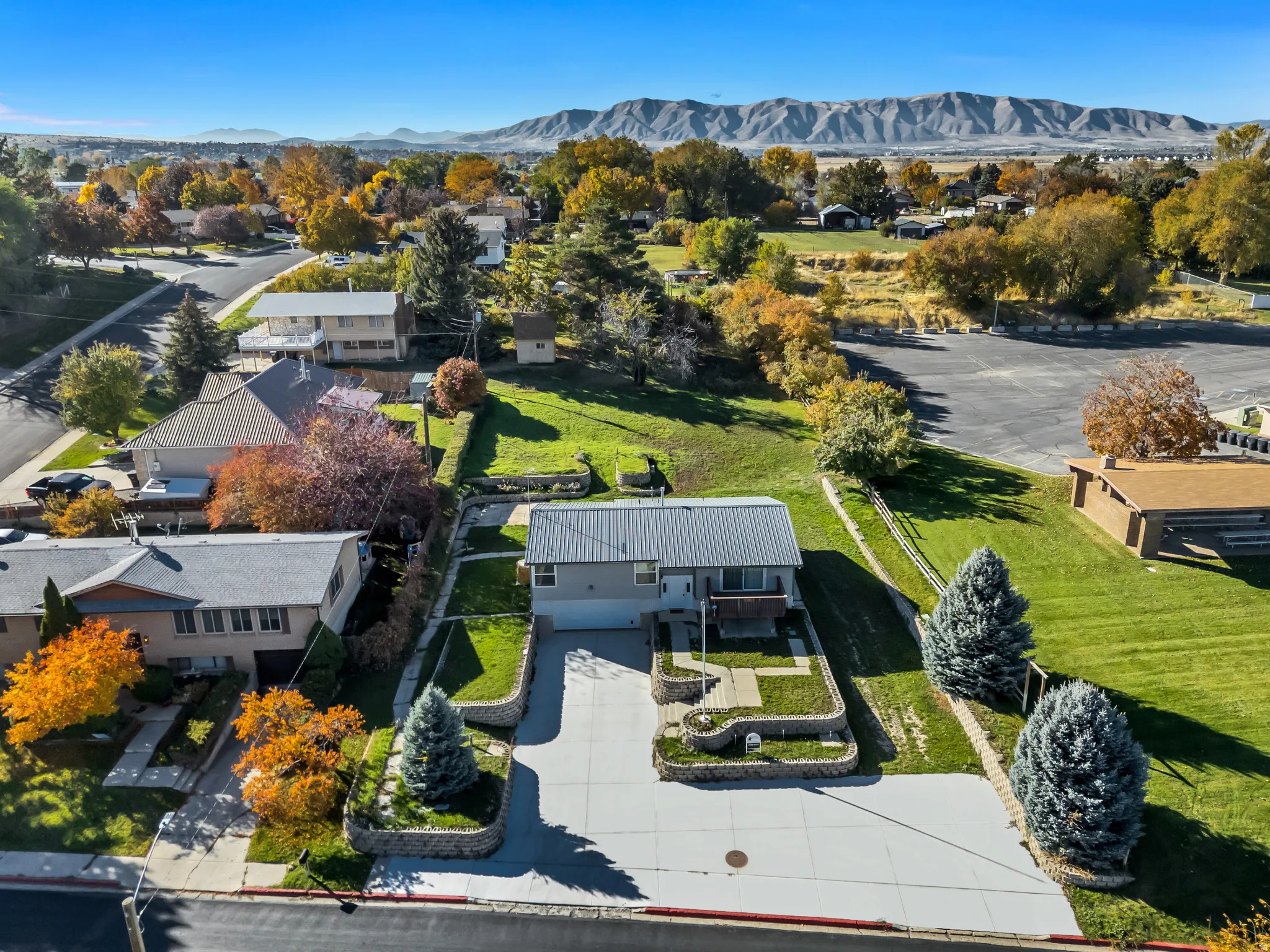 Aerial perspective of suburban area with a mountainous background