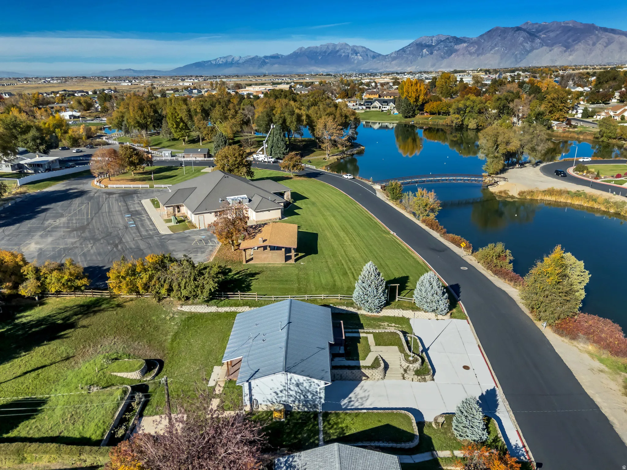 Aerial view of residential area featuring a water and mountain view