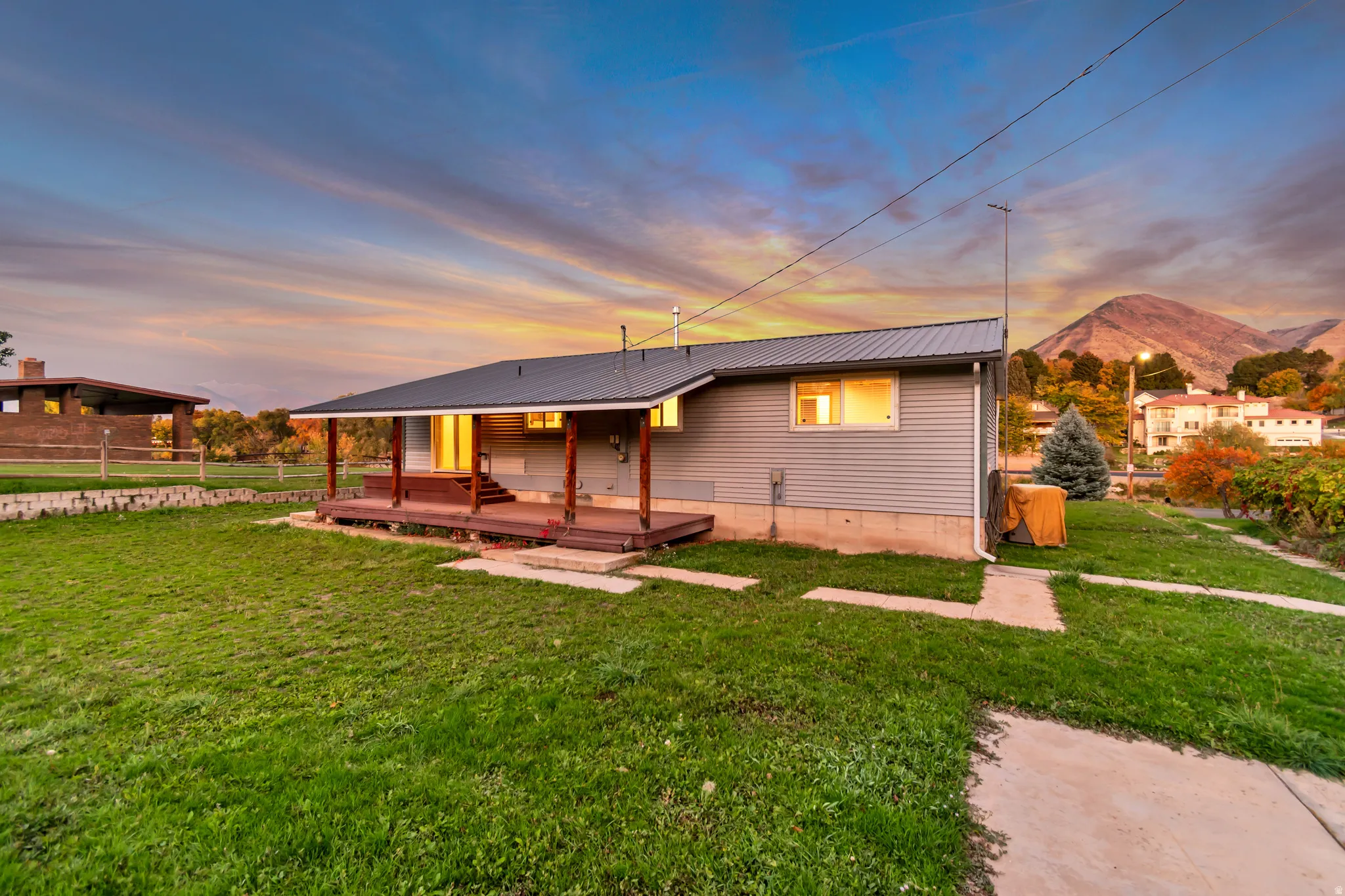 View of front of home with a metal roof and a mountain view