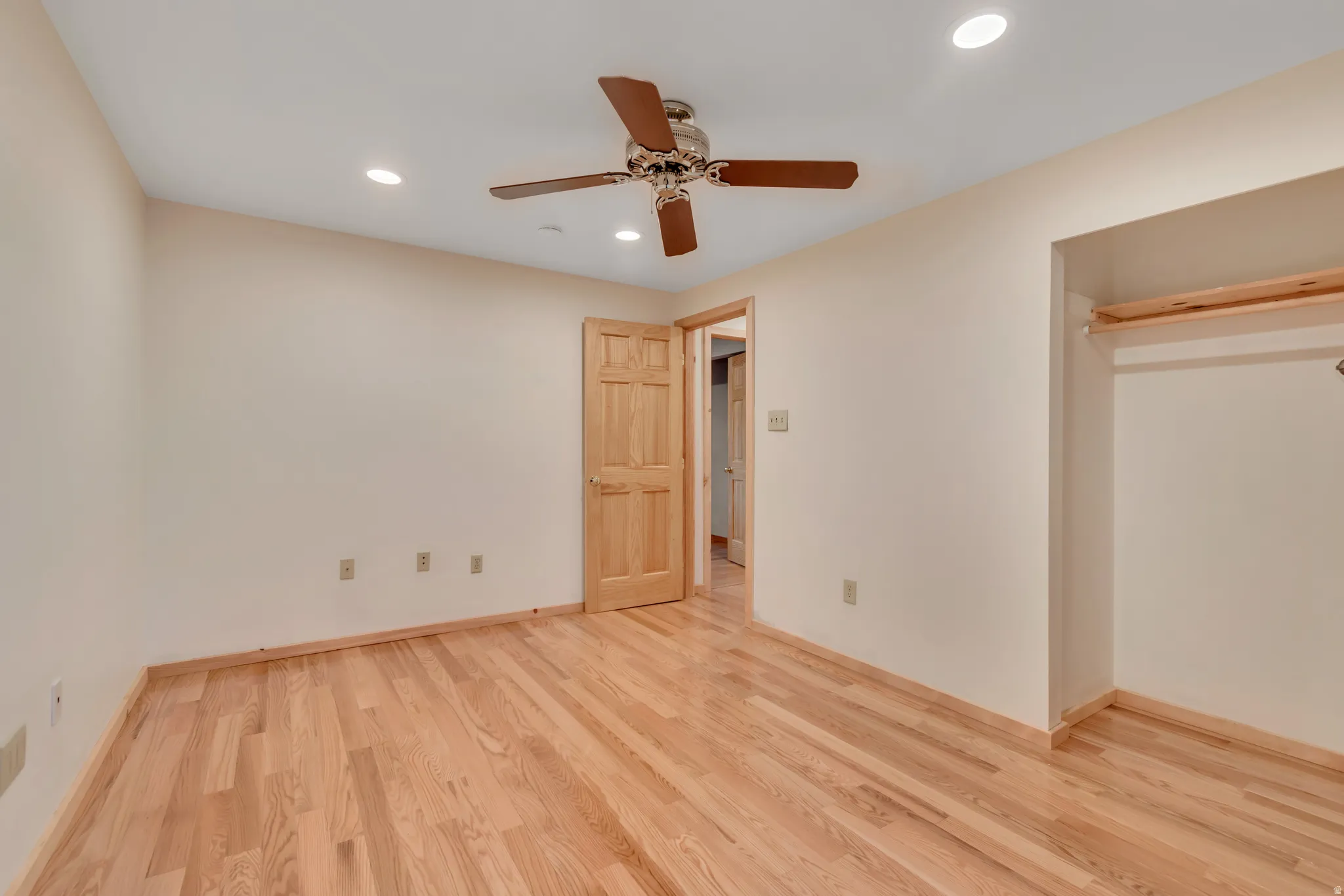 Unfurnished bedroom with recessed lighting, light wood finished floors, and a ceiling fan