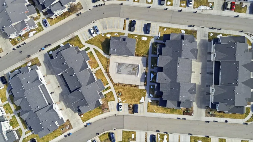 Aerial view of property's location featuring nearby suburban area