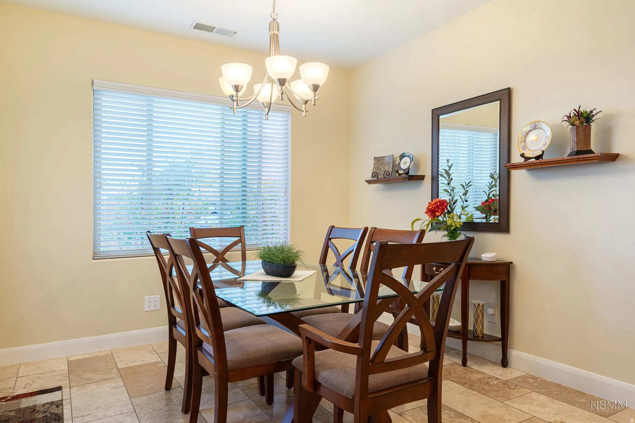 Dining area with baseboards and suspended lighting
