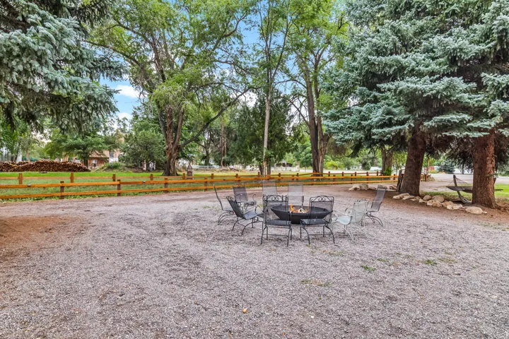 View of yard with a fire pit and a patio