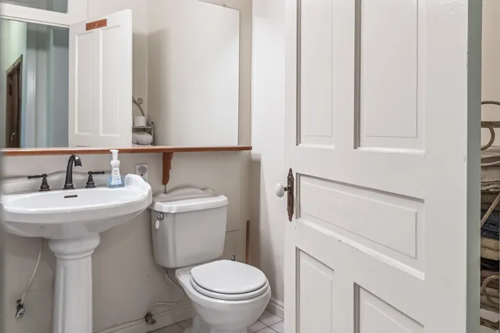 Bathroom with toilet and tile patterned flooring