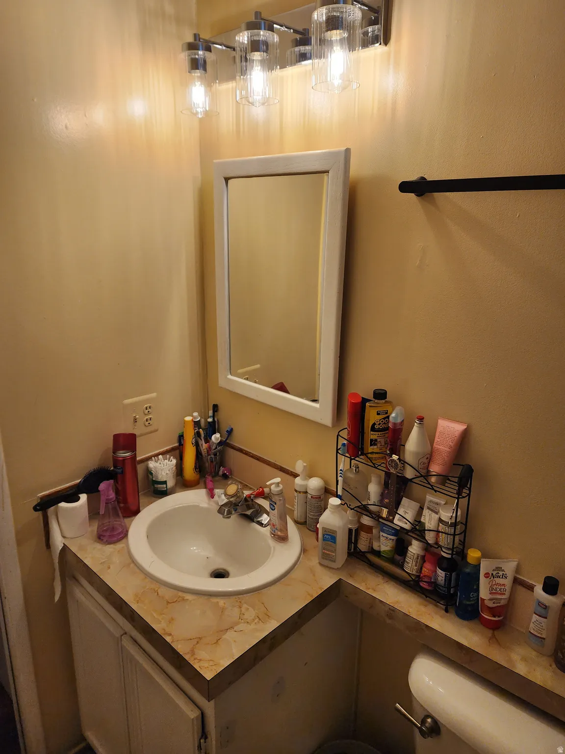 Half bathroom featuring vanity