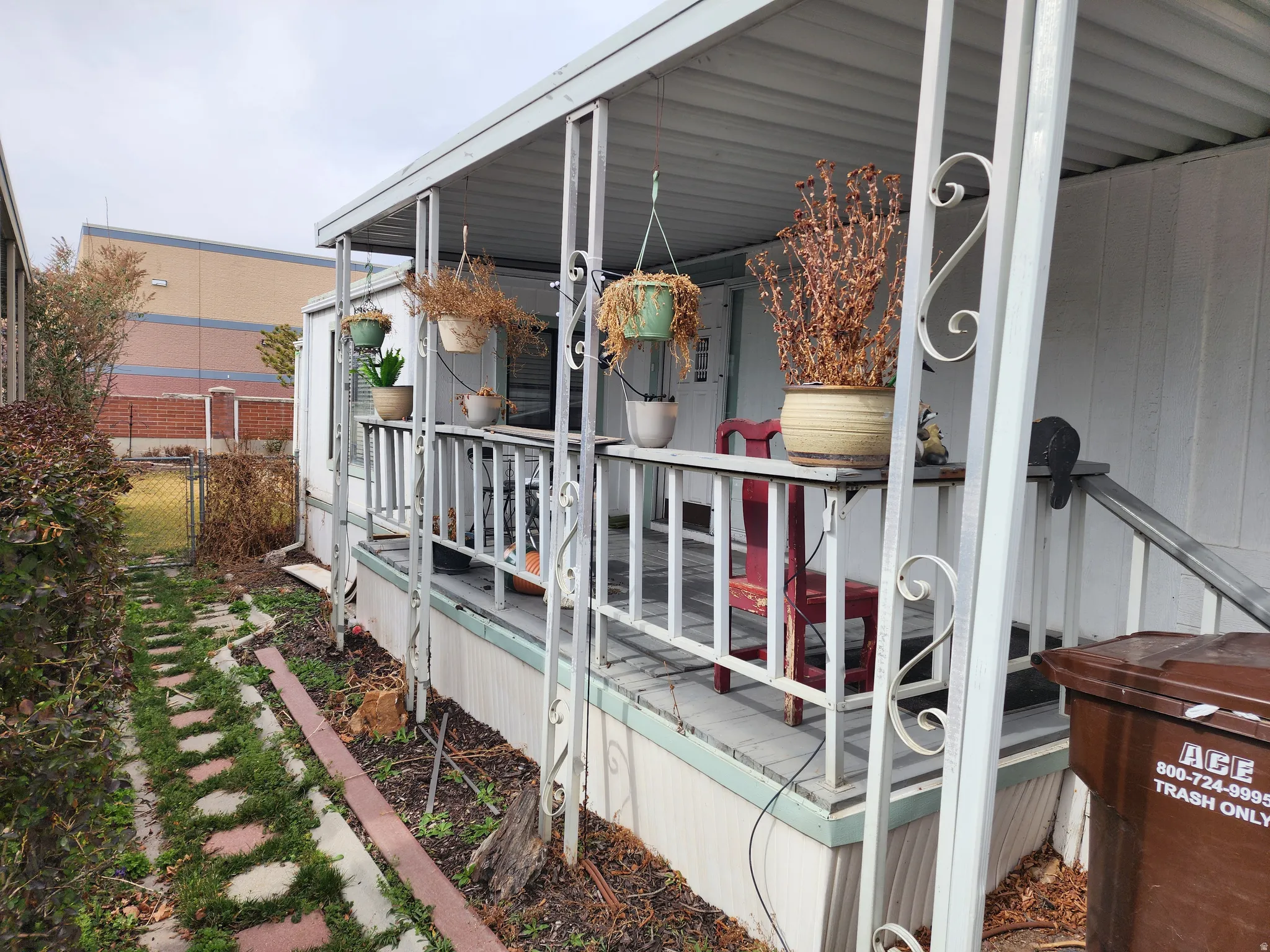 View of side of property featuring a gate