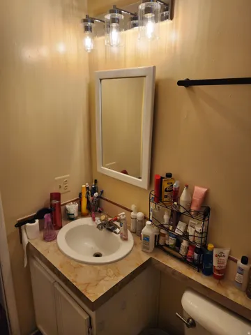 Half bathroom featuring vanity