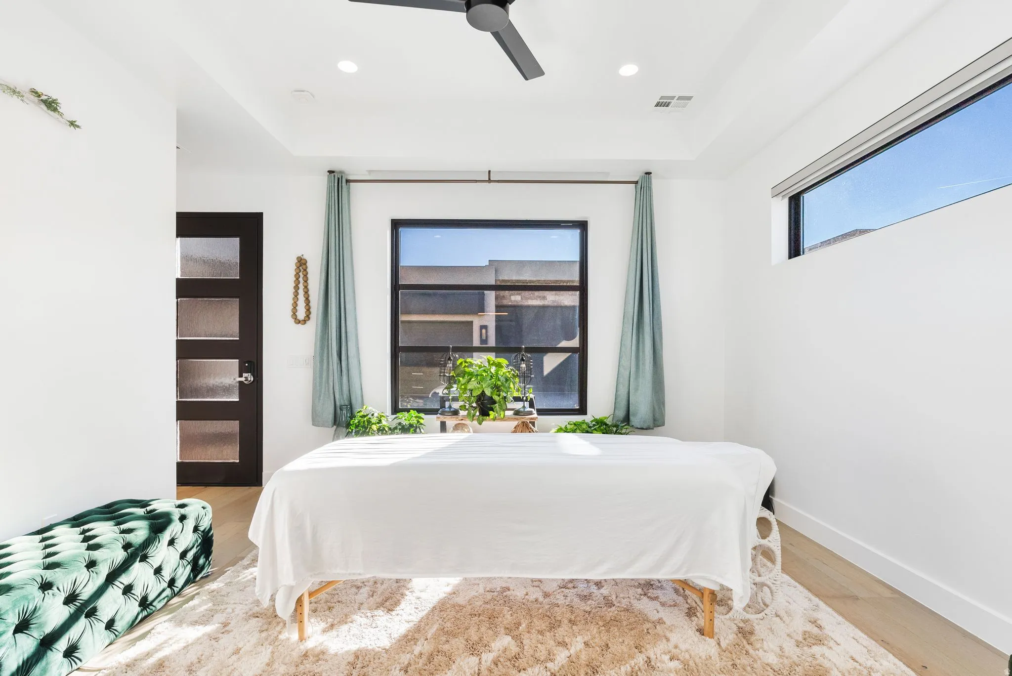 Bedroom featuring light wood-style floors, ceiling fan, and recessed lighting