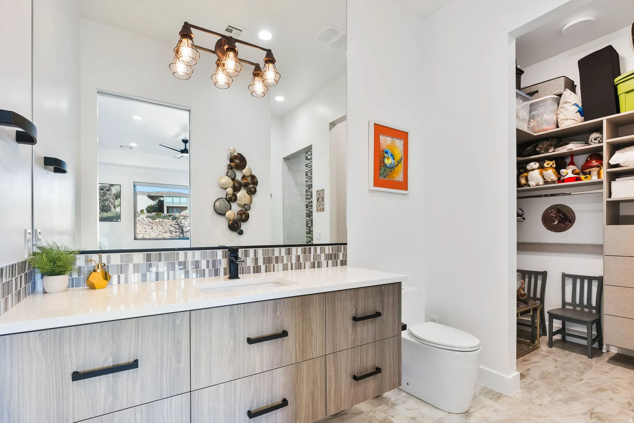 Bathroom with vanity and backsplash