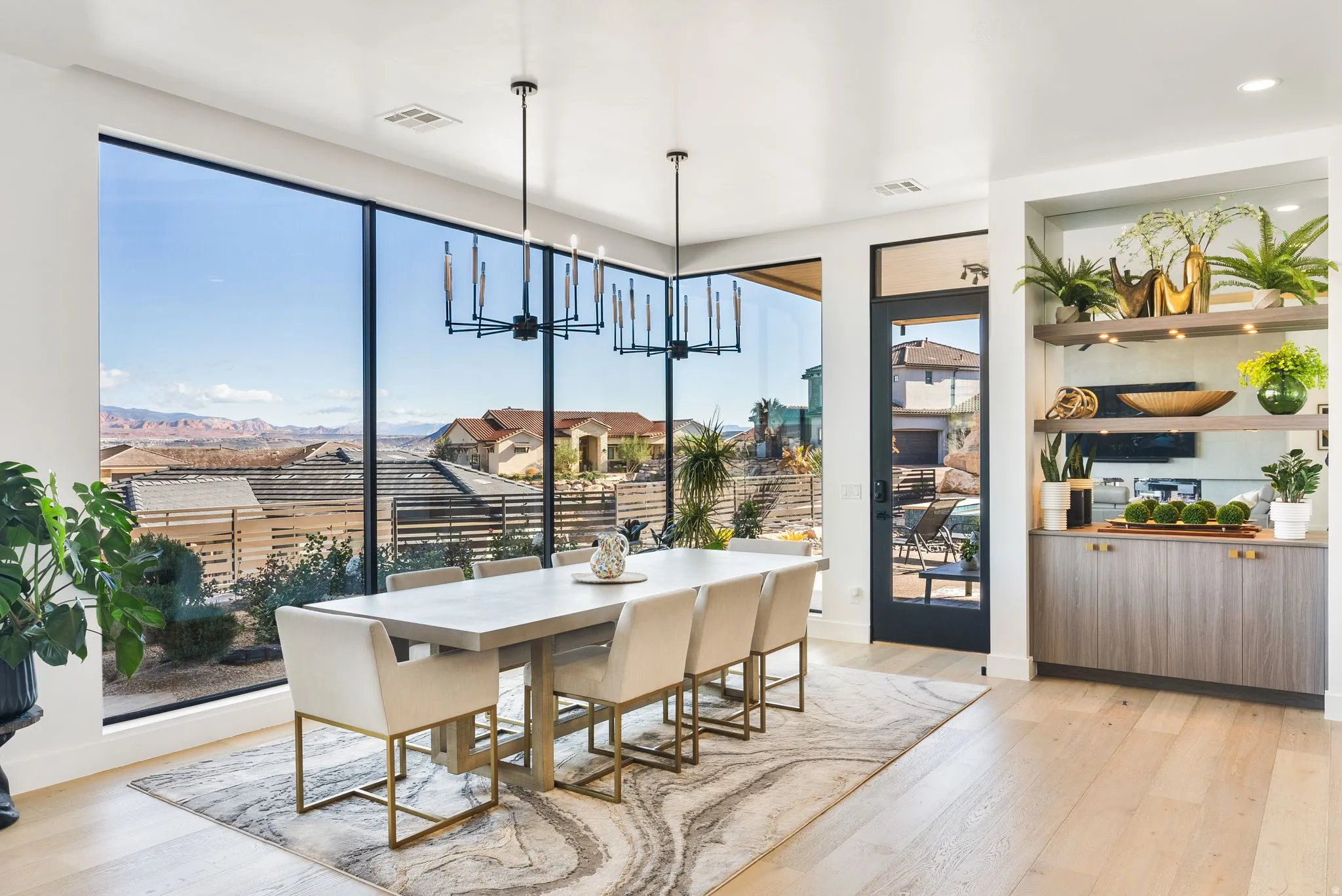 Dining room featuring light wood-style flooring and suspended lighting