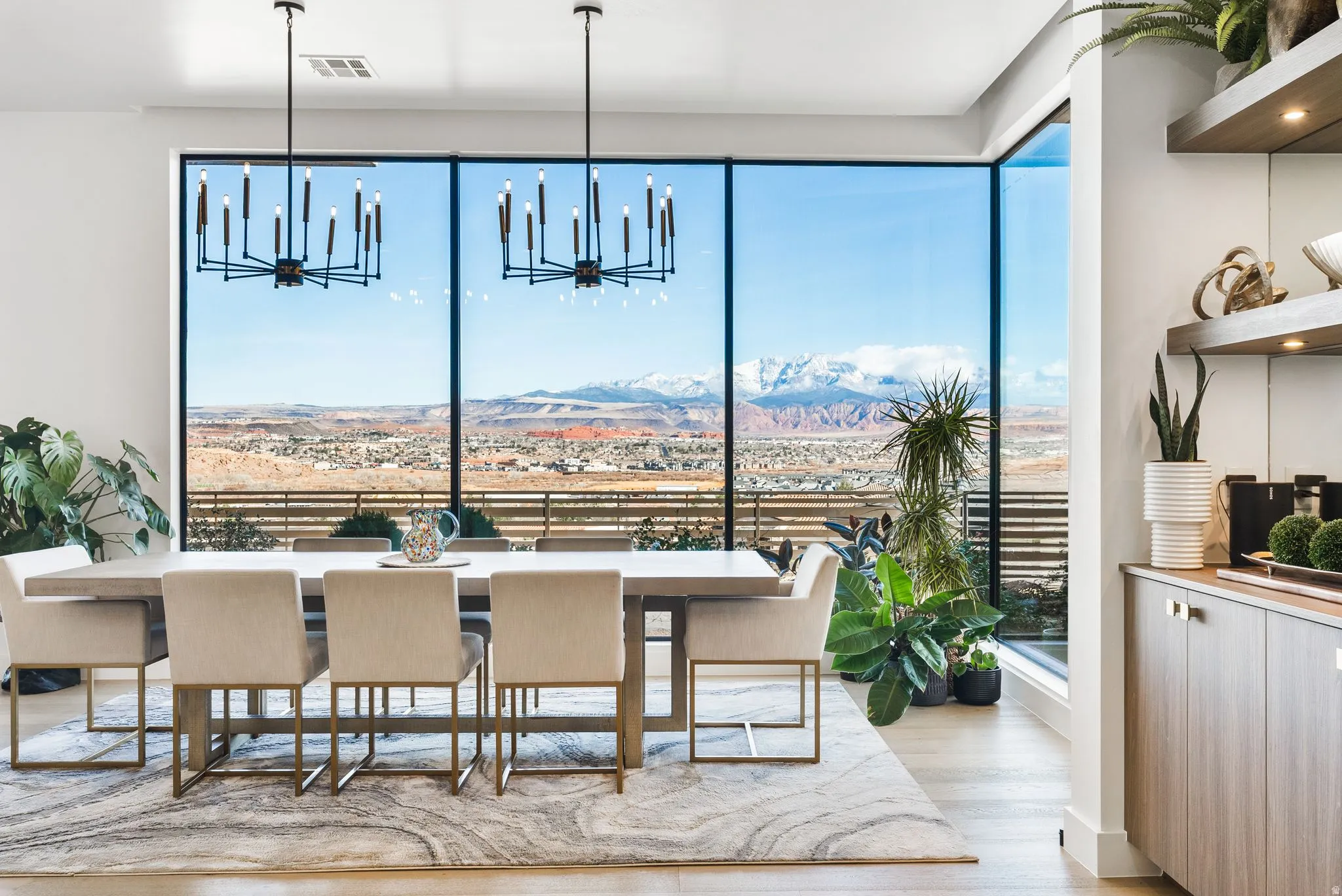 Dining room featuring a mountain view, a chandelier, and light wood-style flooring