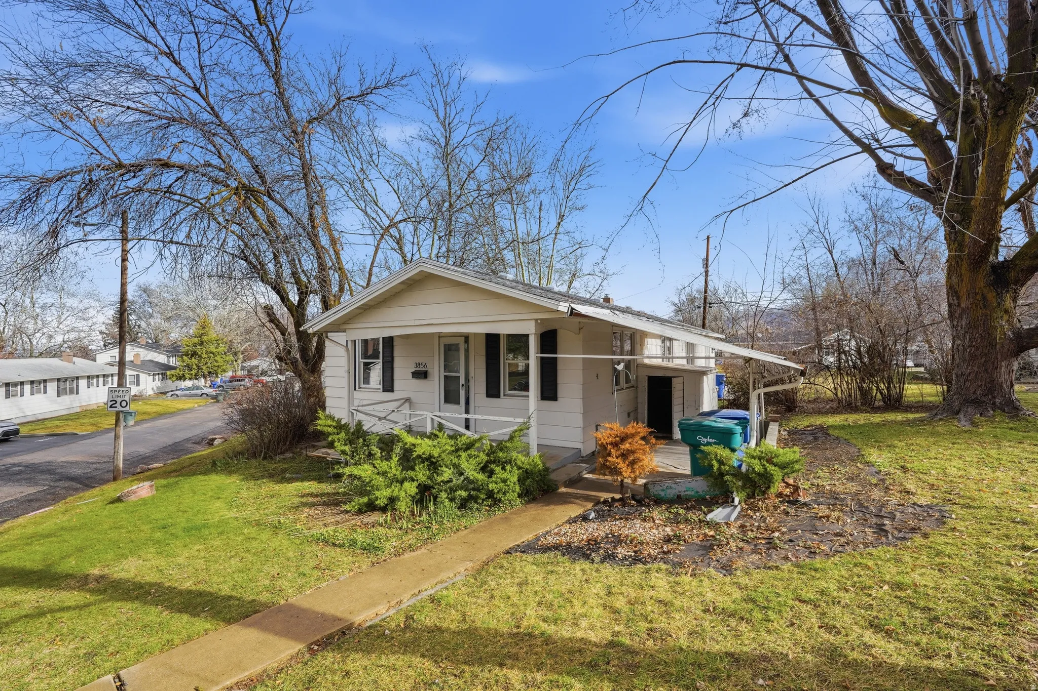 Bungalow-style home featuring covered porch and a front yard