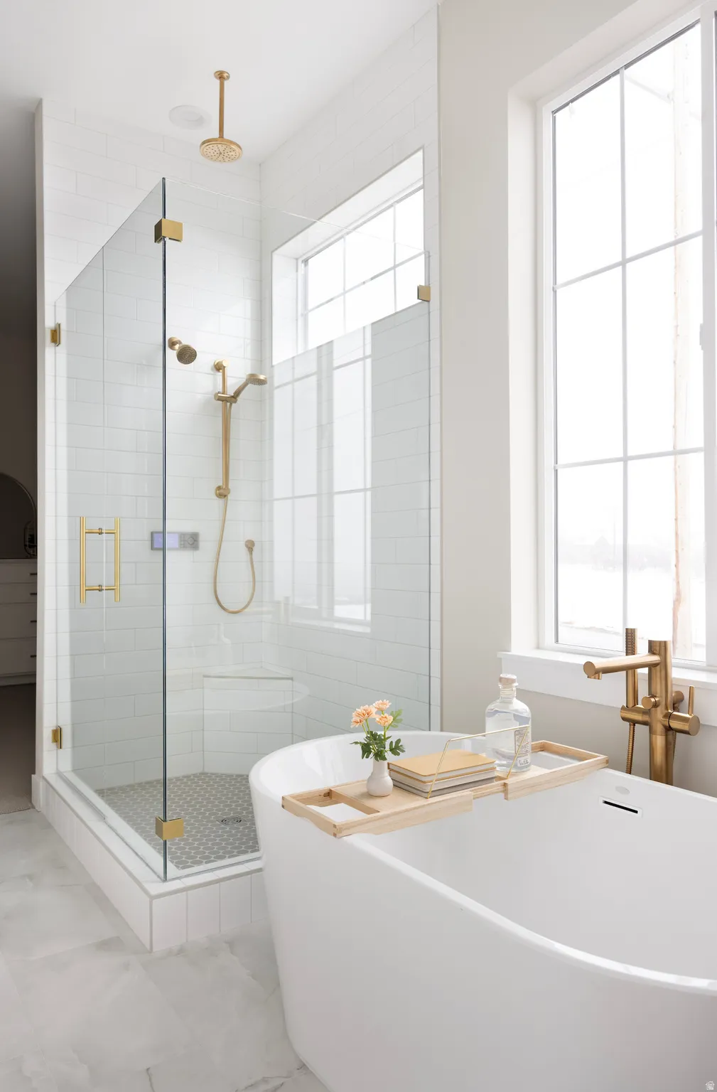 Full bathroom featuring a freestanding bath and a stall shower