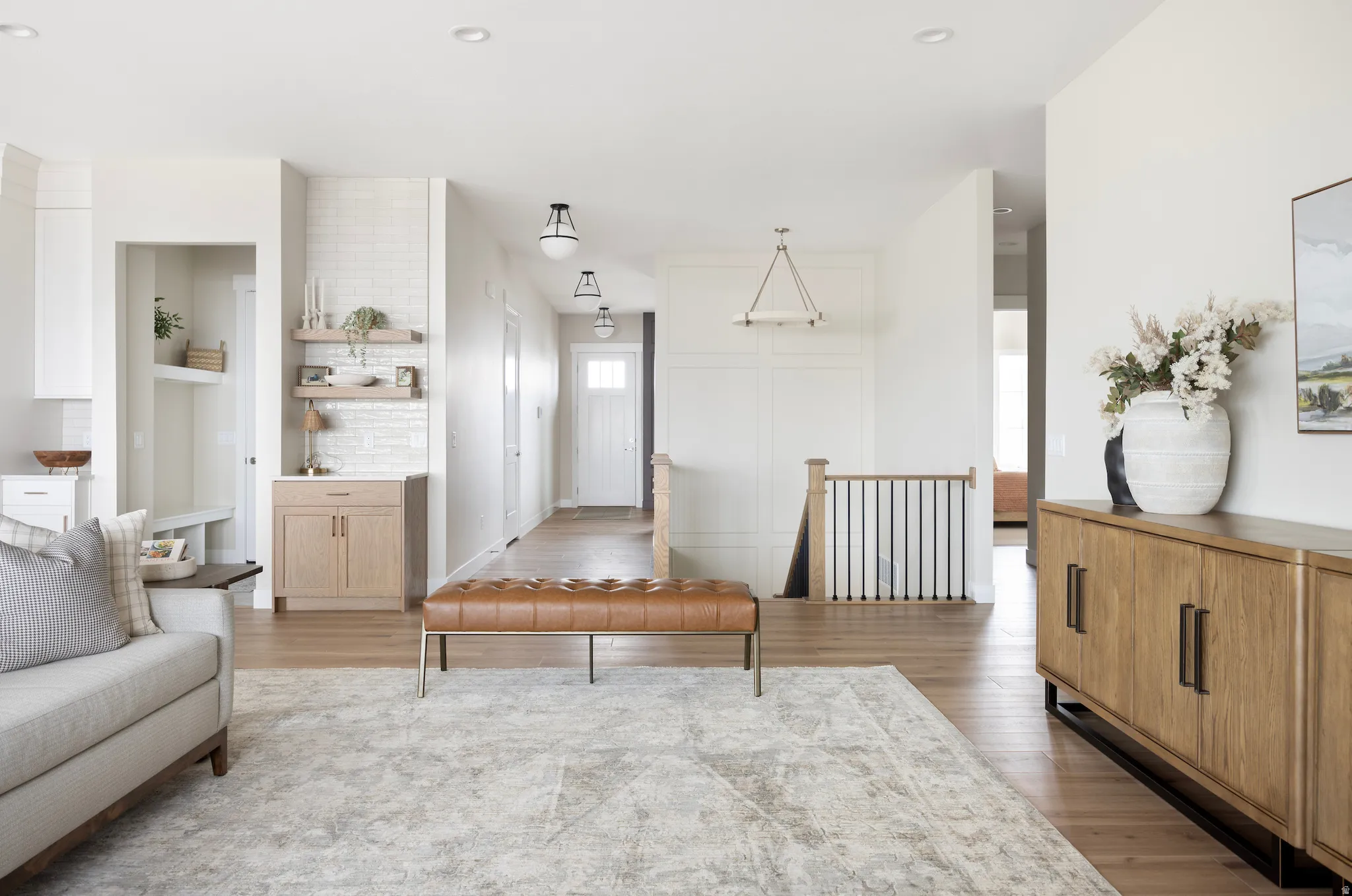 Living area featuring wood finished floors and recessed lighting