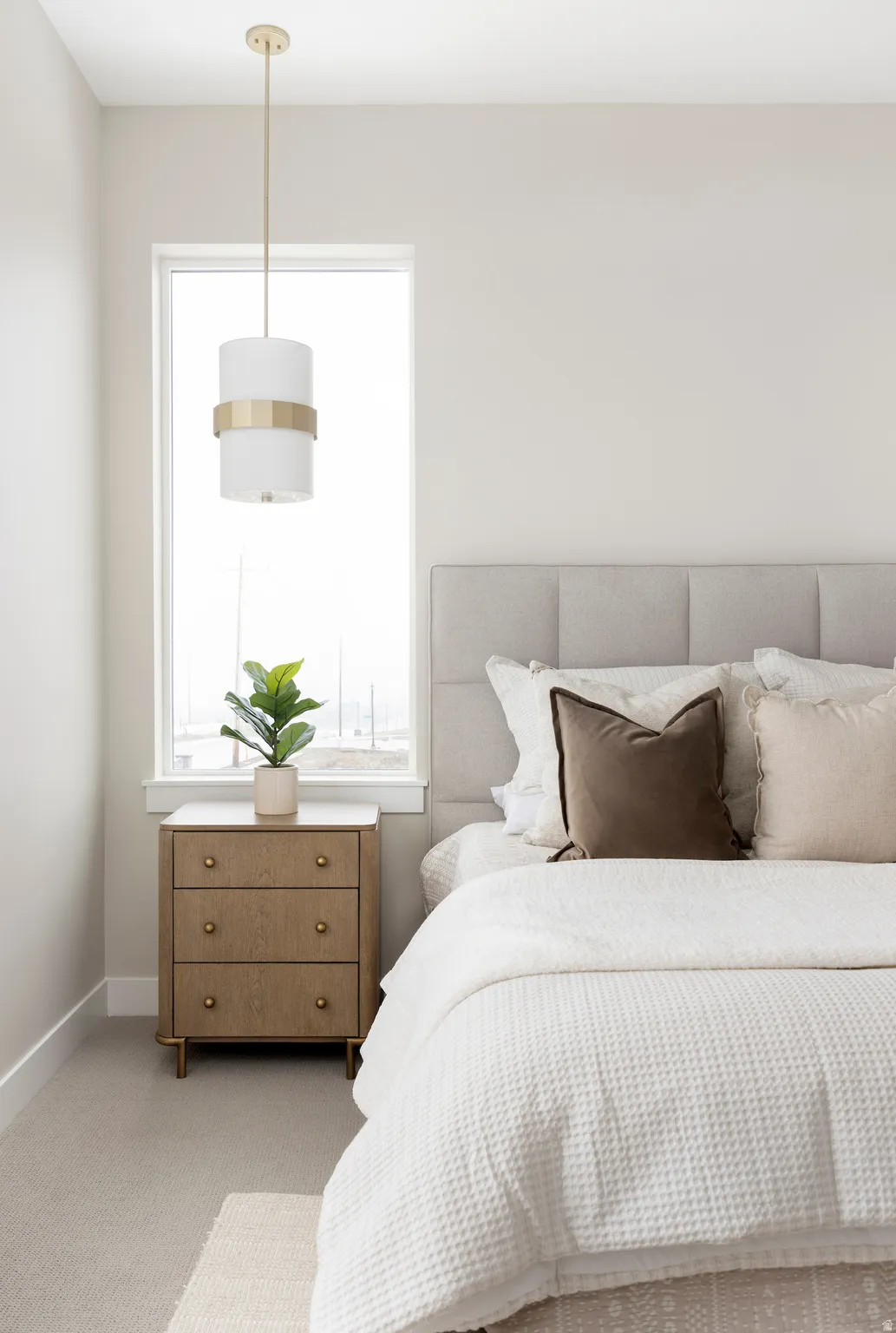 Carpeted bedroom with multiple windows