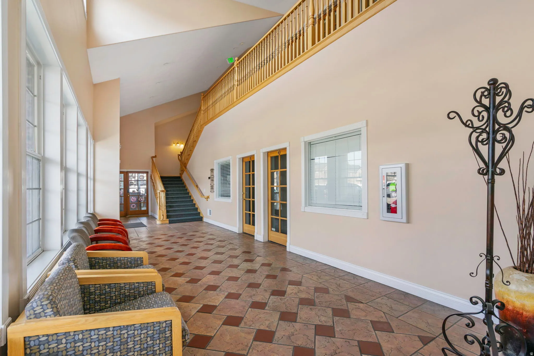 Entrance foyer with stairway and a high ceiling