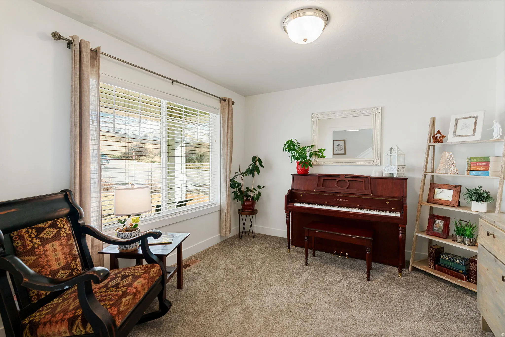 Sitting room with light carpet and baseboards