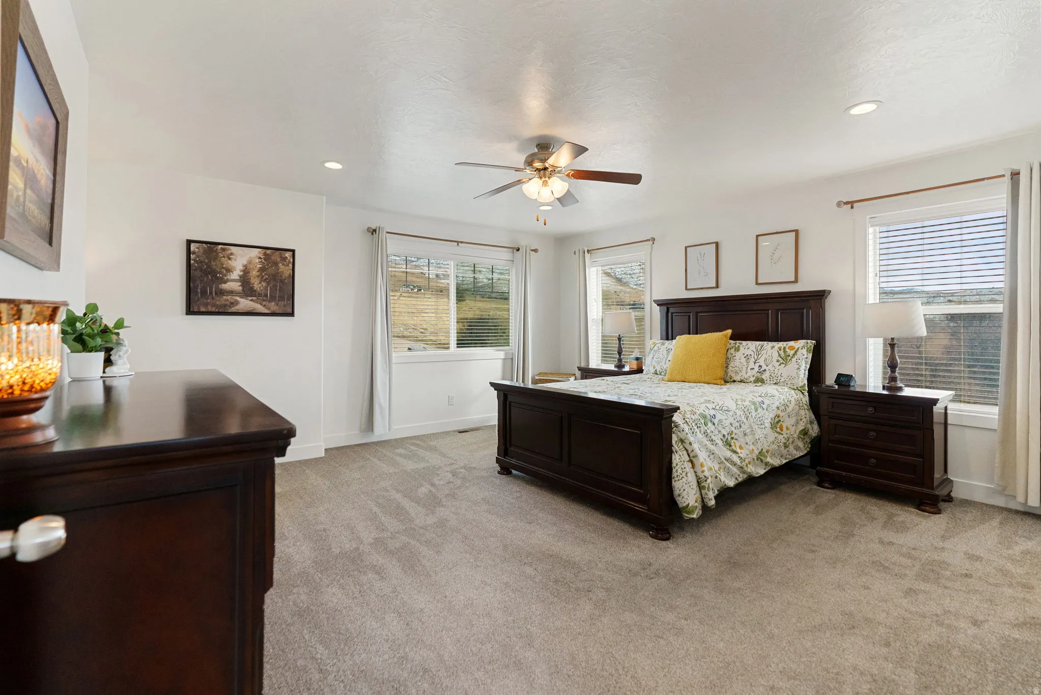 Bedroom featuring light carpet, recessed lighting, and a ceiling fan
